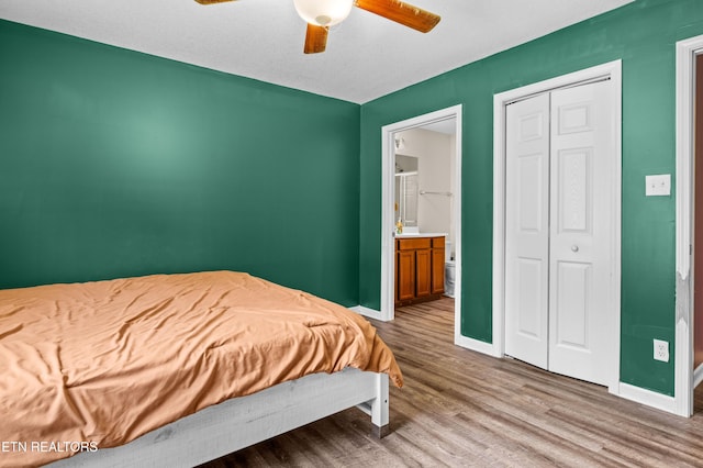 350 Hartfield Ln, Loudon, TN 37774 - bedroom with wood finished floors, baseboards, ceiling fan, ensuite bathroom, and a closet