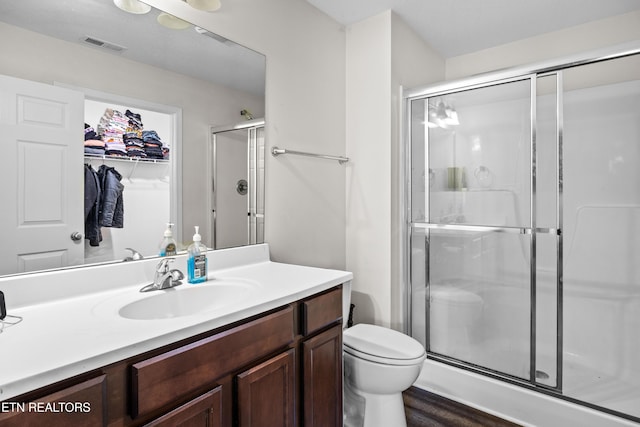 350 Hartfield Ln, Loudon, TN 37774 - full bathroom with a shower stall, vanity, toilet, and a spacious closet