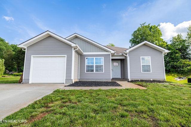 350 Hartfield Ln, Loudon, TN 37774 - ranch-style house with a garage, a front yard, concrete driveway, and board and batten siding