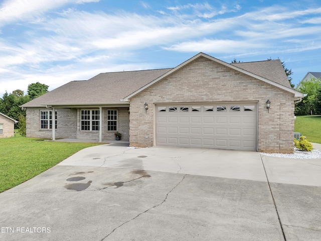 ranch-style home with brick siding, a shingled roof, concrete driveway, and a garage