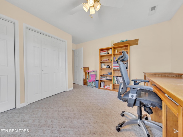 home office with carpet and ceiling fan