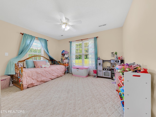 bedroom featuring carpet floors and a ceiling fan