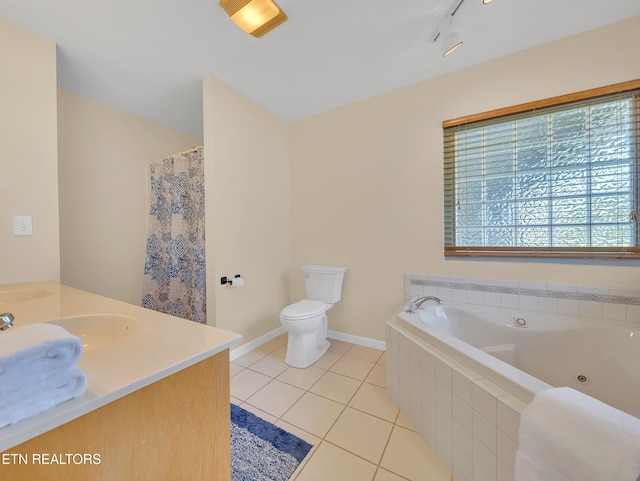 full bathroom with tile patterned flooring, toilet, a jetted tub, baseboards, and vanity