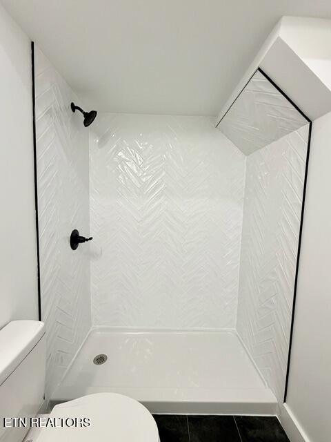 1118 NW Mercer St, Knoxville, TN 37921 - full bathroom with toilet, a stall shower, and tile patterned floors