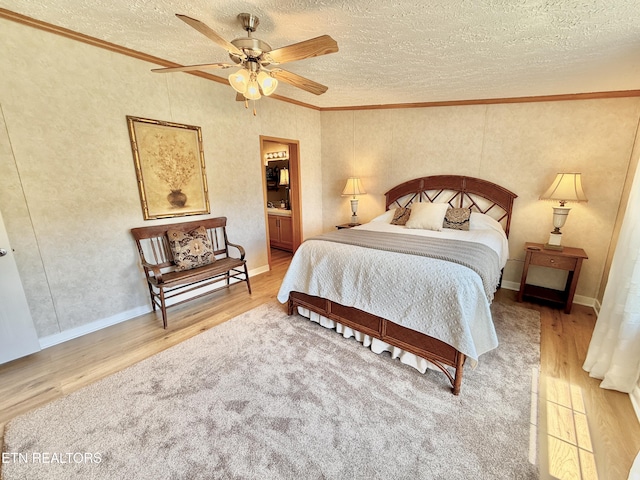 bedroom with wood finished floors, crown molding, a textured ceiling, a ceiling fan, and connected bathroom
