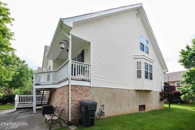 rear view of property with a lawn