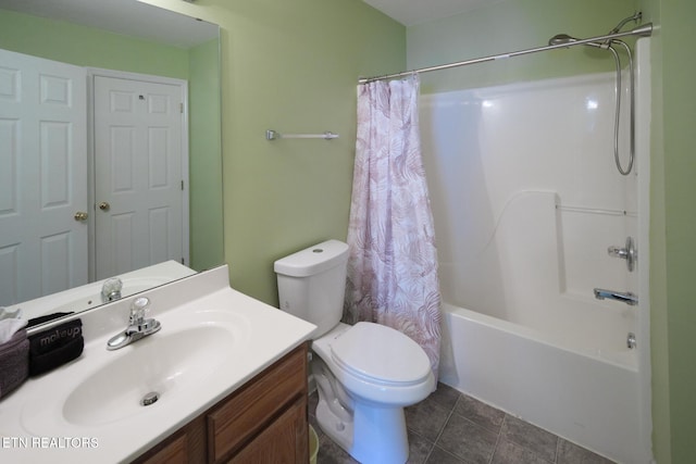 bathroom featuring vanity, toilet, shower / bath combo with shower curtain, and tile patterned floors