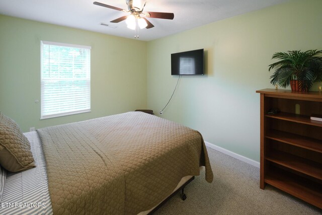 bedroom featuring carpet flooring, baseboards, and ceiling fan