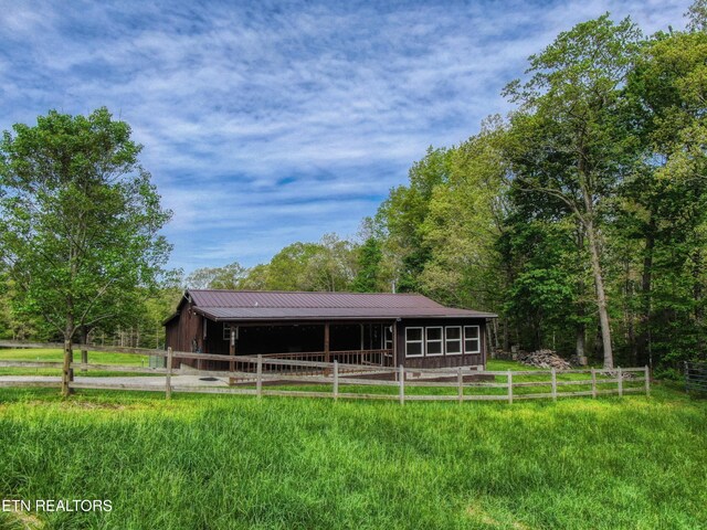 112 Auda Story, Jamestown, TN 38556 - back of house with an exterior structure, an outbuilding, and metal roof