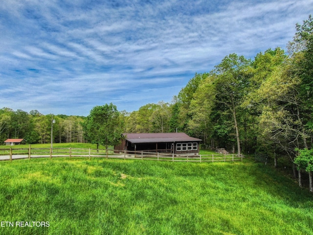 112 Auda Story, Jamestown, TN 38556 - view of yard with an outbuilding, a forest view, an exterior structure, fence, and a pole building