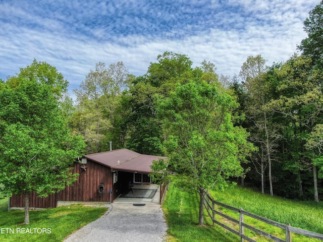 112 Auda Story, Jamestown, TN 38556 - view of front of house featuring asphalt driveway, fence, a carport, and a view of trees