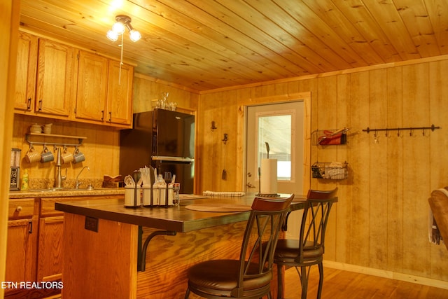 112 Auda Story, Jamestown, TN 38556 - bar featuring freestanding refrigerator, wood finished floors, wood walls, and wood ceiling