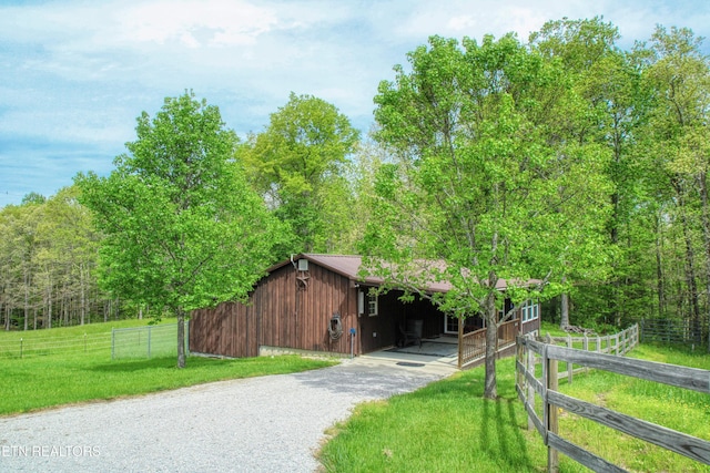 112 Auda Story, Jamestown, TN 38556 - view of front of house with asphalt driveway, an outbuilding, and a view of trees