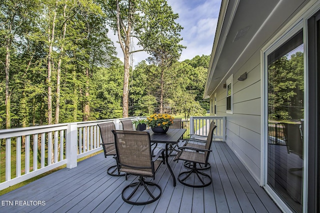 133 Nebraska Ave, Oak Ridge, TN 37830 - deck with outdoor dining area and a wooded view