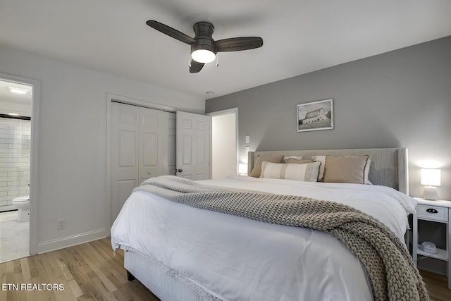 133 Nebraska Ave, Oak Ridge, TN 37830 - bedroom with light wood-style floors, a closet, ensuite bathroom, a ceiling fan, and baseboards