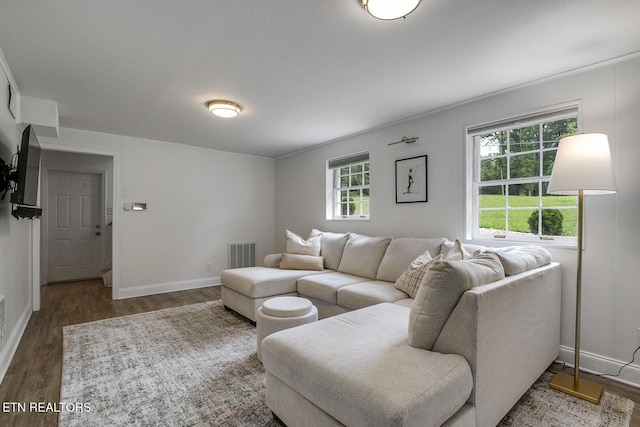 133 Nebraska Ave, Oak Ridge, TN 37830 - living room with healthy amount of natural light, wood finished floors, and baseboards