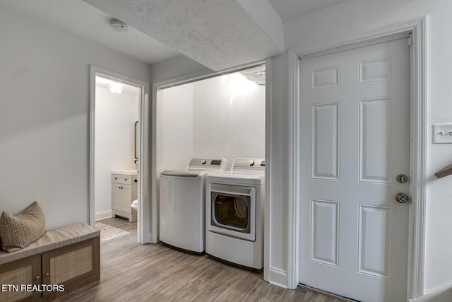 133 Nebraska Ave, Oak Ridge, TN 37830 - washroom with washer and dryer, light wood-type flooring, and baseboards