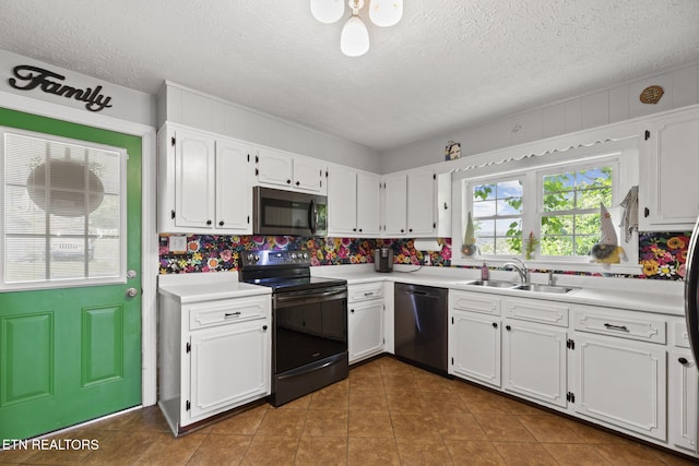 313 Lamar Ave, Clinton, TN 37716 - kitchen featuring appliances with stainless steel finishes, a sink, white cabinets, light countertops, and a textured ceiling
