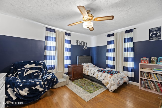 313 Lamar Ave, Clinton, TN 37716 - bedroom featuring hardwood / wood-style floors, ceiling fan, and a textured ceiling