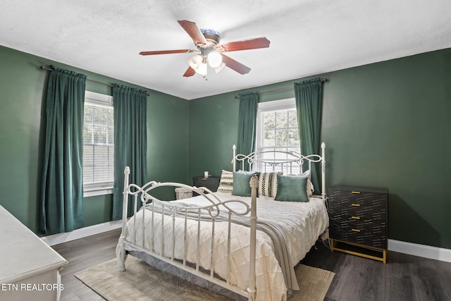 313 Lamar Ave, Clinton, TN 37716 - bedroom with wood finished floors, baseboards, ceiling fan, and a textured ceiling