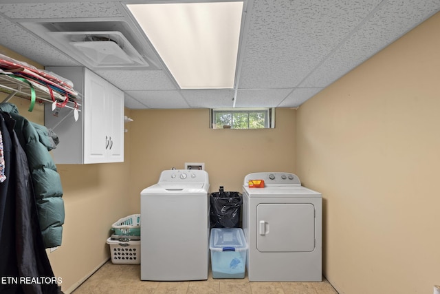 313 Lamar Ave, Clinton, TN 37716 - laundry area with cabinet space and washing machine and dryer