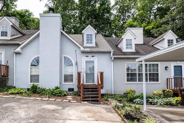 119 Hanover Pl, Oak Ridge, TN 37830 - view of property with a shingled roof, stucco siding, and a chimney