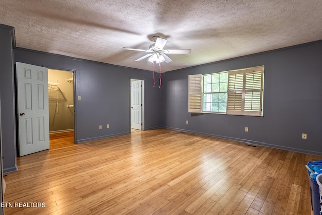 119 Hanover Pl, Oak Ridge, TN 37830 - unfurnished room featuring a textured ceiling, ceiling fan, light wood finished floors, and baseboards