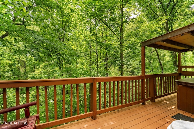 wooden terrace with a forest view