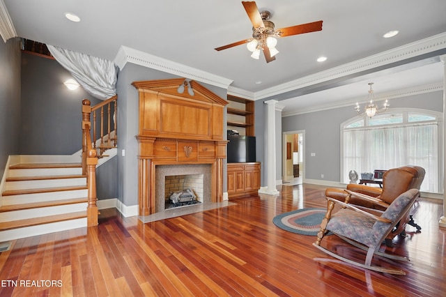 6005 Powell Valley Rd, Big Stone Gap, VA 24219 - living room featuring wood-type flooring, stairway, baseboards, decorative columns, and ceiling fan