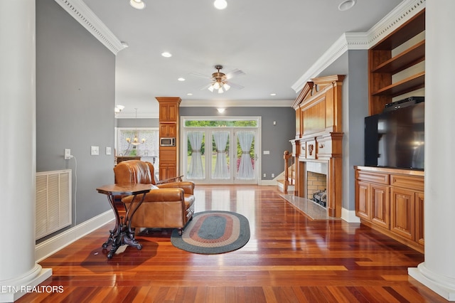 6005 Powell Valley Rd, Big Stone Gap, VA 24219 - living room featuring ceiling fan, a large fireplace, crown molding, wood-type flooring, and recessed lighting