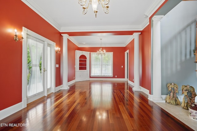 6005 Powell Valley Rd, Big Stone Gap, VA 24219 - unfurnished dining area featuring ornate columns, a chandelier, hardwood / wood-style floors, baseboards, and ornamental molding