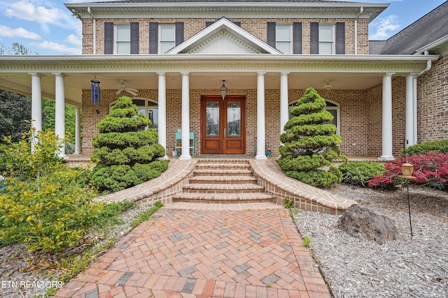 6005 Powell Valley Rd, Big Stone Gap, VA 24219 - doorway to property with french doors, brick siding, and covered porch