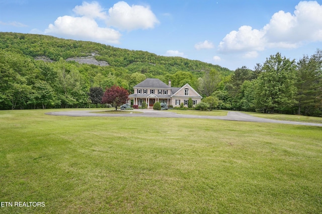 6005 Powell Valley Rd, Big Stone Gap, VA 24219 - view of front of house featuring a view of trees, a front lawn, and asphalt driveway