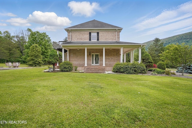 6005 Powell Valley Rd, Big Stone Gap, VA 24219 - view of front of house with brick siding, a front yard, and a porch