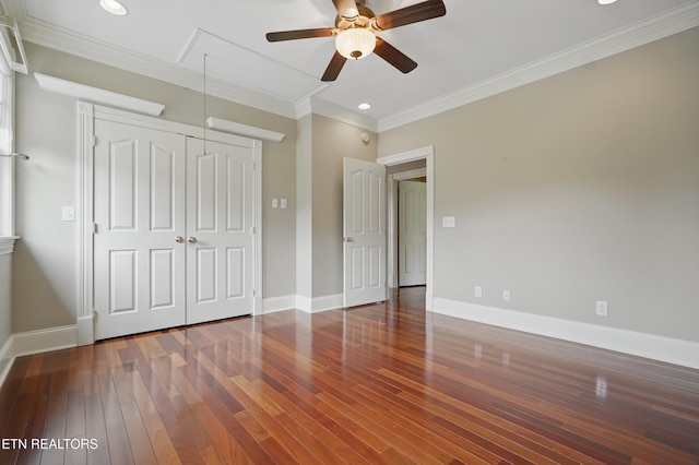 6005 Powell Valley Rd, Big Stone Gap, VA 24219 - unfurnished bedroom with attic access, hardwood / wood-style floors, crown molding, a closet, and baseboards