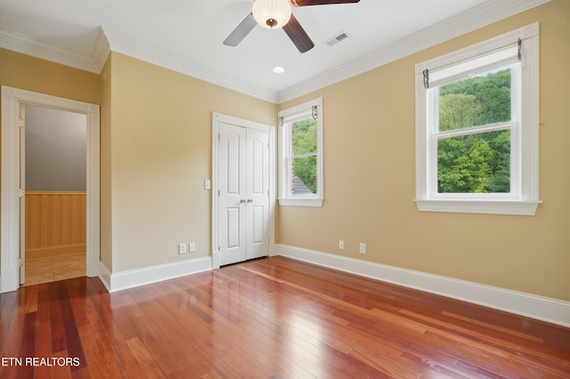 6005 Powell Valley Rd, Big Stone Gap, VA 24219 - unfurnished bedroom featuring hardwood / wood-style flooring, baseboards, a closet, crown molding, and ceiling fan