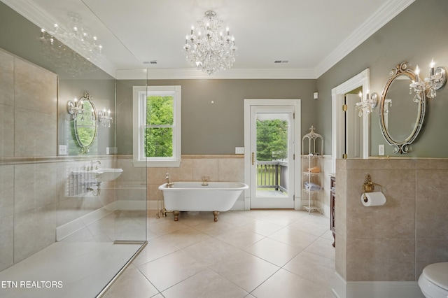 6005 Powell Valley Rd, Big Stone Gap, VA 24219 - bathroom with tile walls, a chandelier, a freestanding tub, tile patterned flooring, and a wainscoted wall