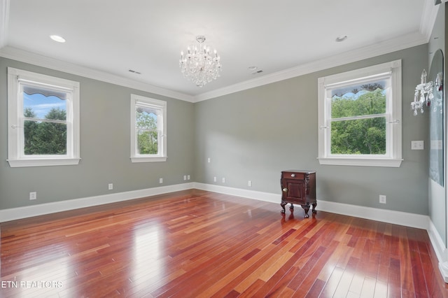6005 Powell Valley Rd, Big Stone Gap, VA 24219 - spare room featuring a chandelier, wood-type flooring, crown molding, and baseboards