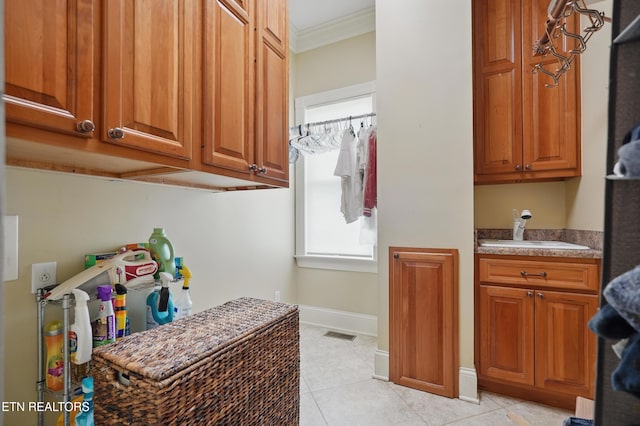 6005 Powell Valley Rd, Big Stone Gap, VA 24219 - laundry room featuring a sink, crown molding, and light tile patterned floors