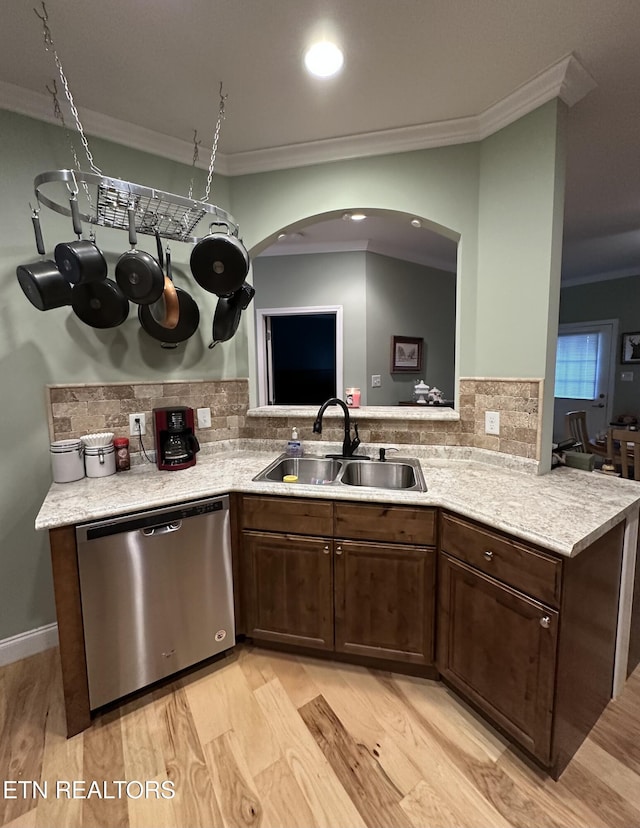 1923 Big Chiefs Skyview Dr, Sevierville, TN 37876 - kitchen featuring stainless steel dishwasher, a sink, crown molding, light wood-style flooring, and light countertops
