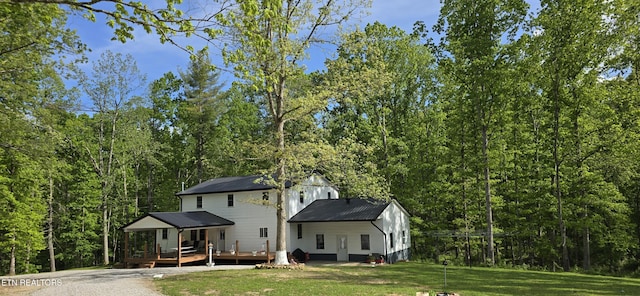 166 Knepp Rd, Deer Lodge, TN 37726 - back of house with a wooden deck, a lawn, and a forest view
