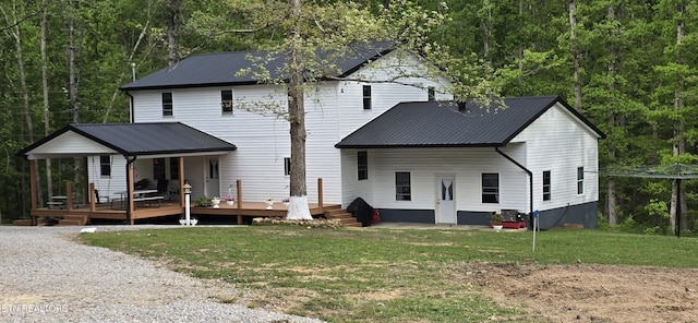 166 Knepp Rd, Deer Lodge, TN 37726 - rear view of house featuring a yard, metal roof, and a wooded view