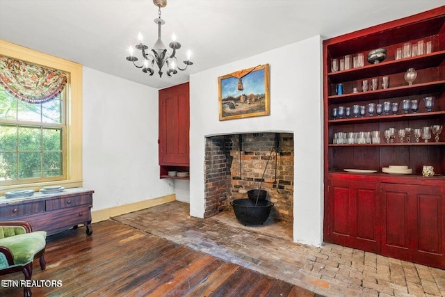 living area with a chandelier and hardwood / wood-style flooring