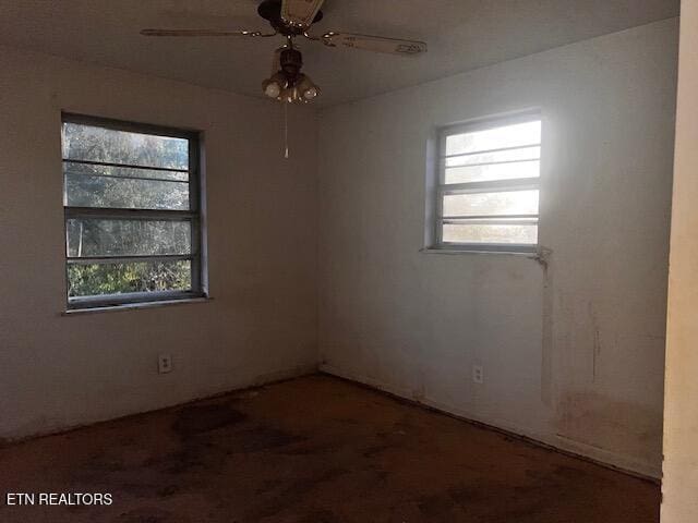 867 Pleasant Ridge Rd, Lafollette, TN 37766 - empty room with healthy amount of natural light, a ceiling fan, and wood finished floors