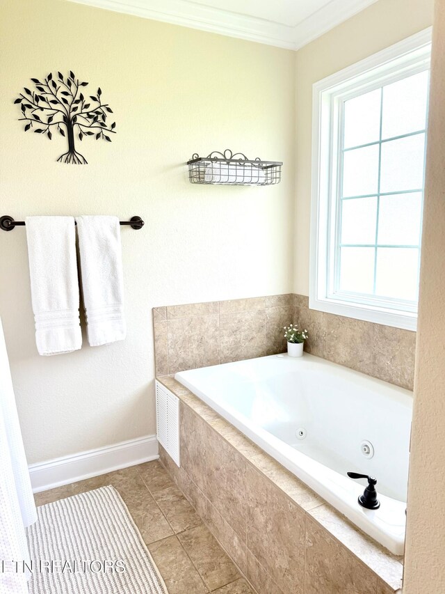 1617 Millstone Dr, Maryville, TN 37803 - bathroom featuring ornamental molding, a tub with jets, tile patterned floors, and baseboards