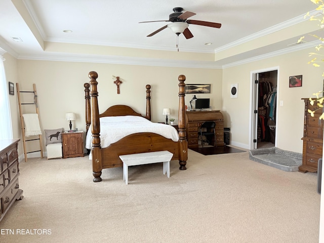 1617 Millstone Dr, Maryville, TN 37803 - bedroom with light colored carpet, a raised ceiling, ornamental molding, a walk in closet, and ceiling fan