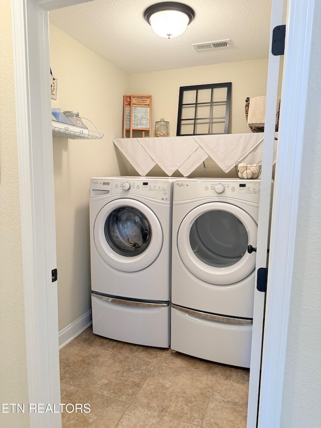 1617 Millstone Dr, Maryville, TN 37803 - washroom featuring washing machine and dryer and a textured ceiling