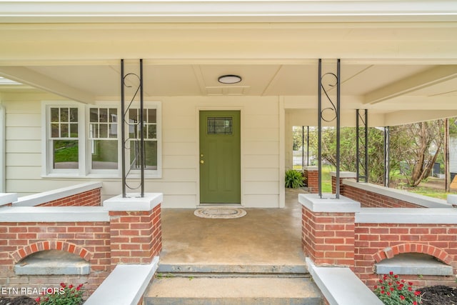 406 S Indiana Ave, Lafollette, TN 37766 - entrance to property featuring covered porch and brick siding