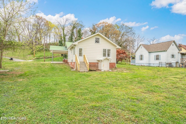 406 S Indiana Ave, Lafollette, TN 37766 - back of house with a lawn