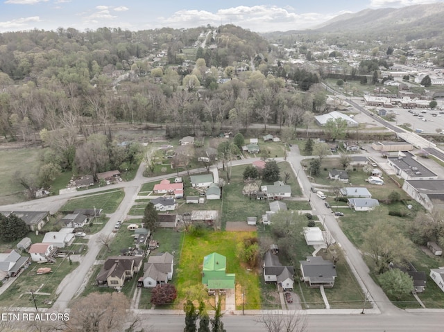 406 S Indiana Ave, Lafollette, TN 37766 - aerial view of property's location with nearby suburban area and a mountain backdrop